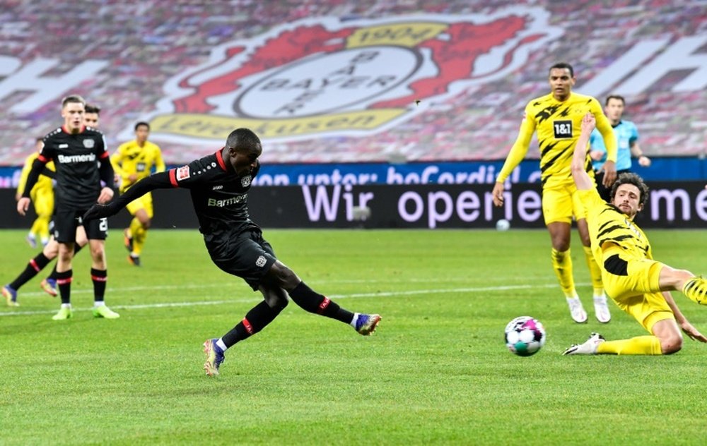 Moussa Diaby fires Bayer Leverkusen ahead against Borussia Dortmund on Tuesday. AFP