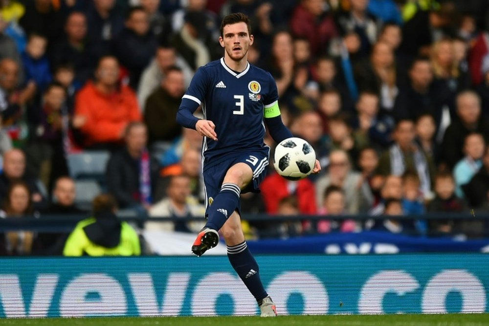 Andy Robertson will miss Scotland's trip to Kazakhstan. AFP