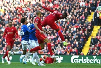 Liverpool overcome Everton in derby to maintain strain on Man City