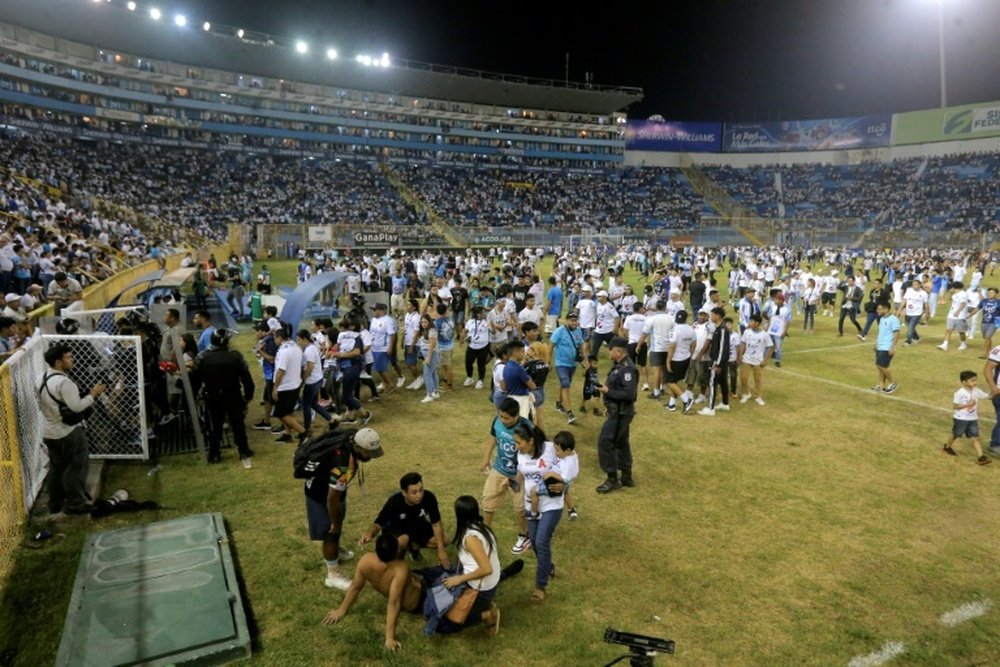 A stampede at a soccer stadium in El Salvadors capital killed 12 people and injured hundreds. AFP