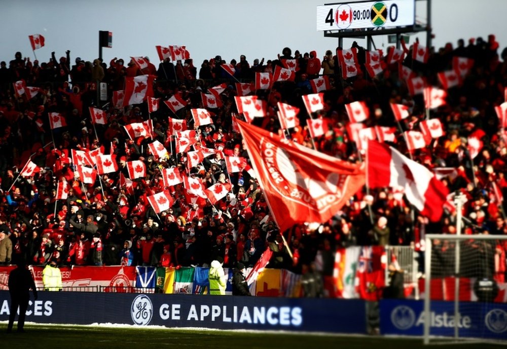 Canadian fans celebrate after the teams qualification for the World Cup in March 2022. AFP