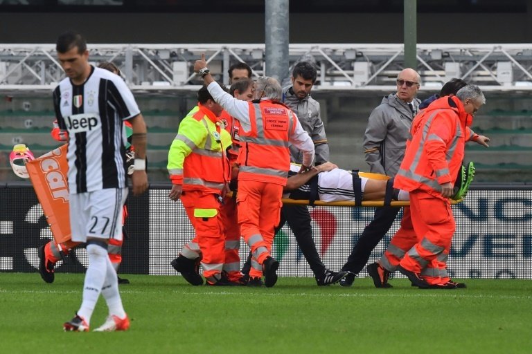 Juventus defender Andrea Barzagli leaves the pitch on a stretcher in the match against Chievo. AFP