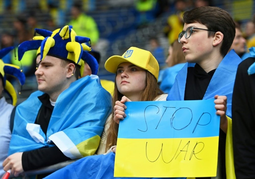 Ukraine supporters held up anti-war banners during Sundays 1-0 defeat to Wales. AFP