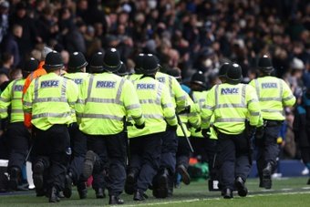 Wolves' FA Cup clash with local rivals West Bromwich Albion was suspended on Sunday after fans fought a bloody battle in the stands.