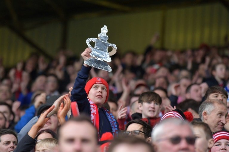 Lincoln fans celebrate after winning . AFP