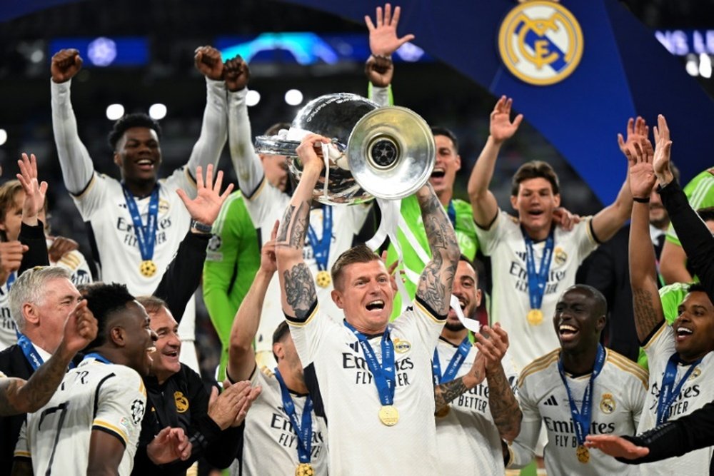 Toni Kroos (C) won a record-equalling sixth Champions League as a player. AFP