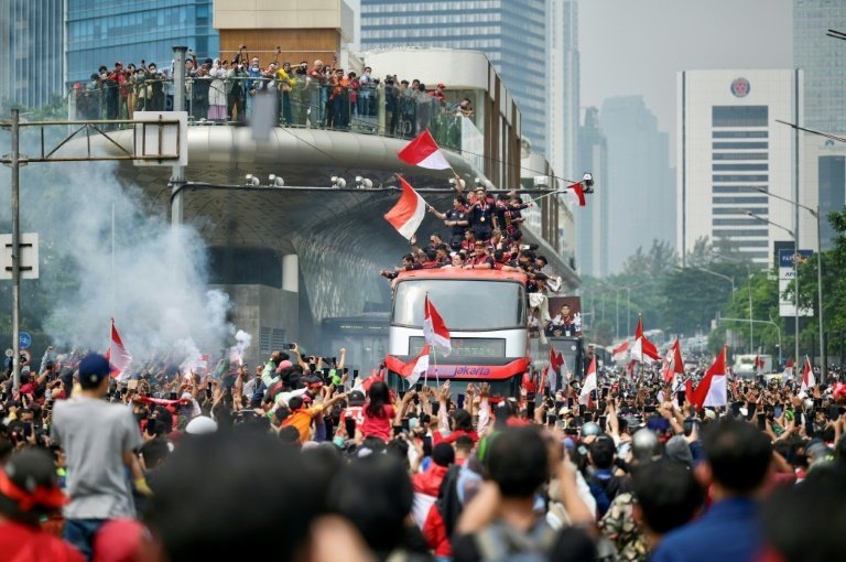 Fans attend a victory parade for Indonesia's football team in Jakarta. AFP