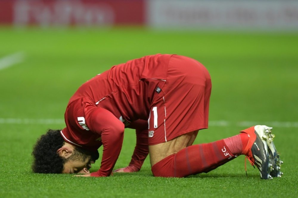 Salah celebrates scoring against Watford. AFP