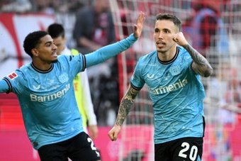Bayer Leverkusen tightened their grip at the top of the Bundesliga with a 2-0 victory over 10-man Cologne to pull 10 points clear of Bayern Munich.