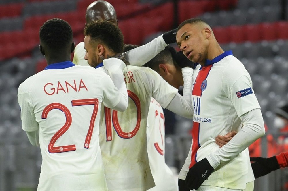 Kylian Mbappe (R) scored twice in PSG's 2-3 win at Bayern. AFP