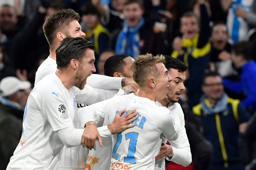 Radonjics late goal pushes Marseille to within five points of PSG. Goal