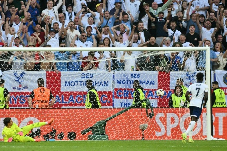 Saka confidently slotted in his penalty. AFP