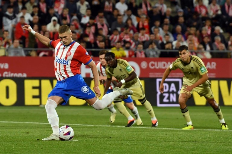 Dovbyk boosted his golden boot hopes with a hat-trick for Girona. AFP