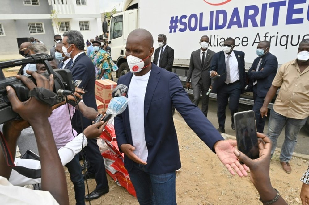 Didier Drogba is giving supplies to poor families in Abidjan. AFP