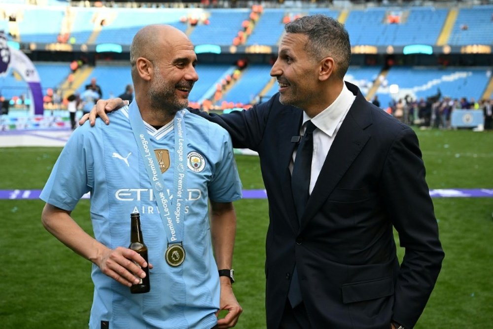 Pep Guardiola (L) has won six Premier League titles in the past seven seasons. AFP