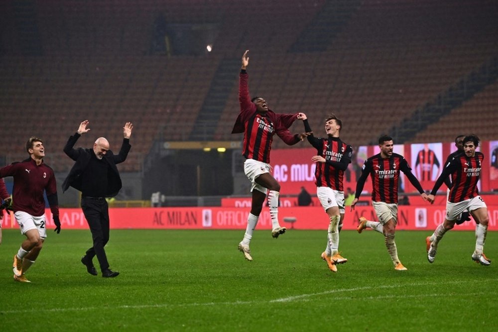 AC Milan are back ahead of Inter after beating Lazio. AFP