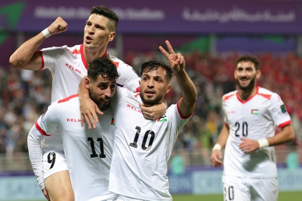 Palestine advance as one of the four best third-placed teams. AFP