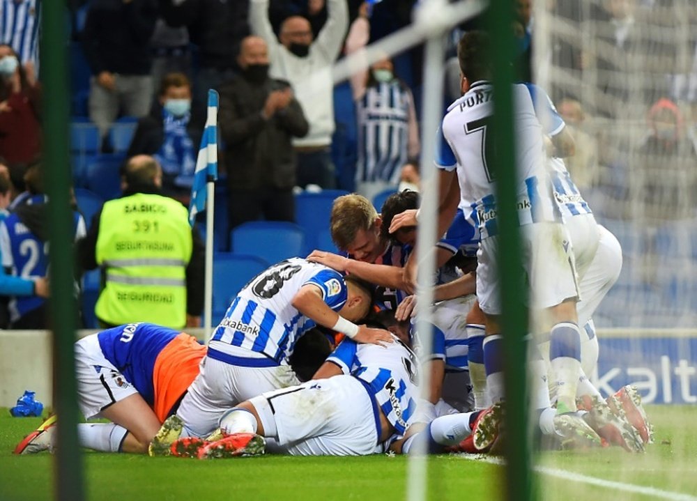 Real Sociedad's players celebrated after Julen Lobete scored his teams winner against Mallorca. AFP