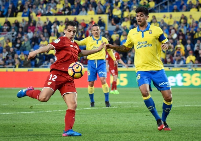 Sevillas forward Wissam Ben Yedder (L) clashes with Las Palmas defender Aythami Artiles