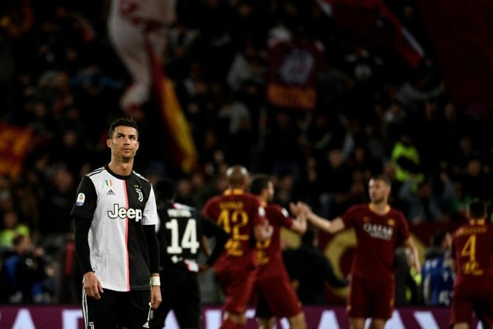 Florenzi, Dzeko keep Roma's Champions League hopes alive