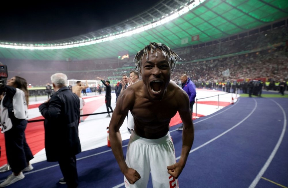 Leipzig defender Mohamed Simakan celebrates winning the German Cup final in Berlin. AFP