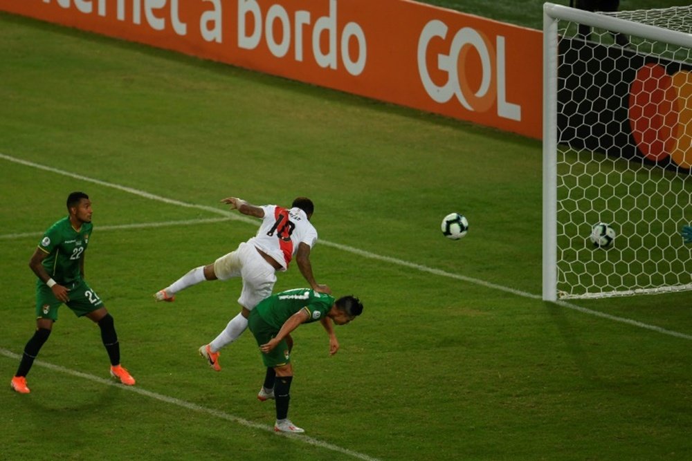 Farfan (c) scored one of Peru's goals v Bolivia. AFP
