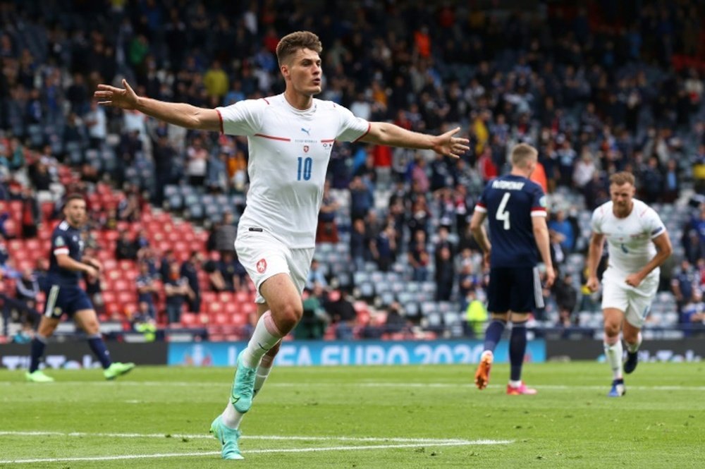 Patrik Schick (left) scored twice to beat Scotland 2-0. AFP