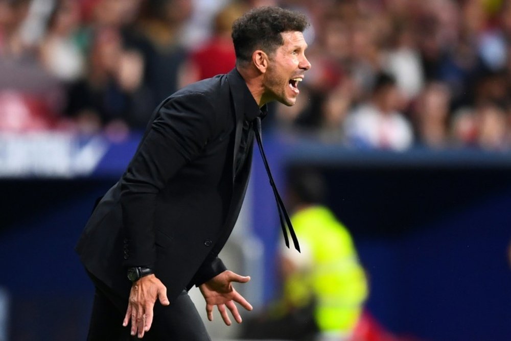 Atlético boss Simeone will look to take advantage of his rival's struggles this weekend. AFP