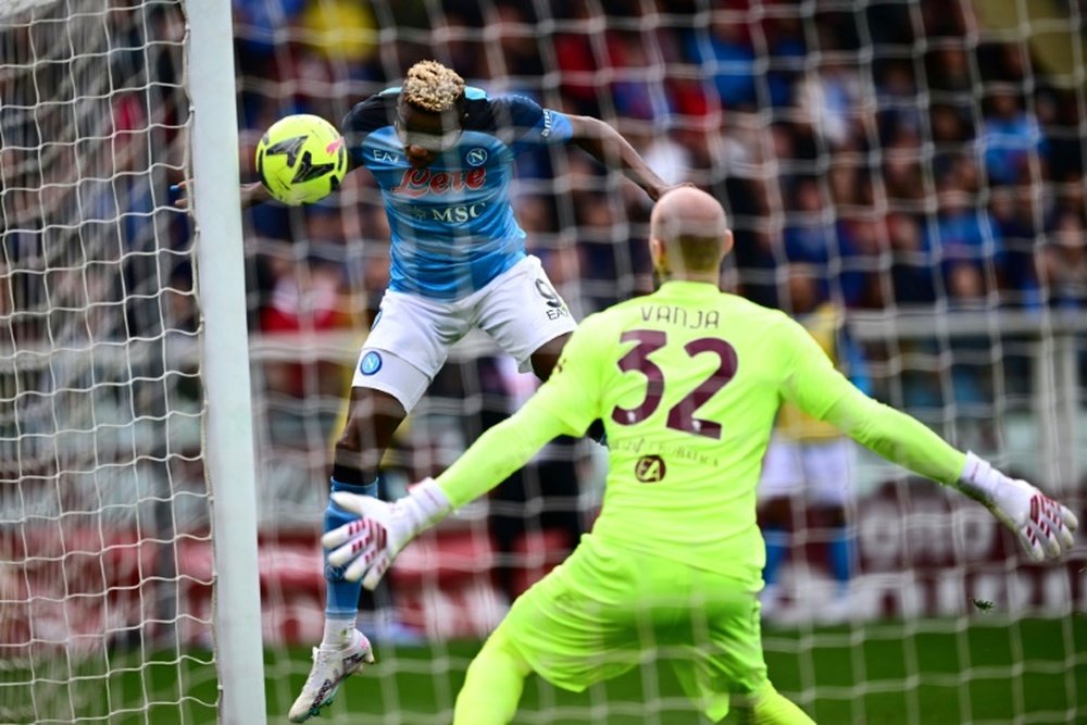 Osimhen (L) netted his 21st Serie A goal of the season as Napoli ran riot at Torino. AFP