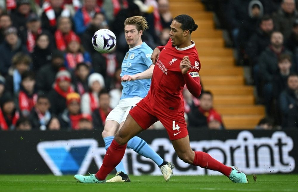 Virgil van Dijk (R) said a 1-1 draw for Liverpool against Manchester City was bittersweet. AFP