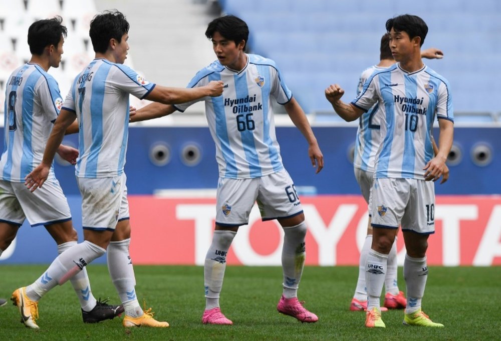 Yoon Bit-garam (R) scored twice as Ulsan qualified for the AFC CL last 16. AFP