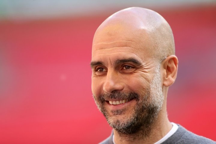 Guardiola calls for Man City cool heads to see off PSG
