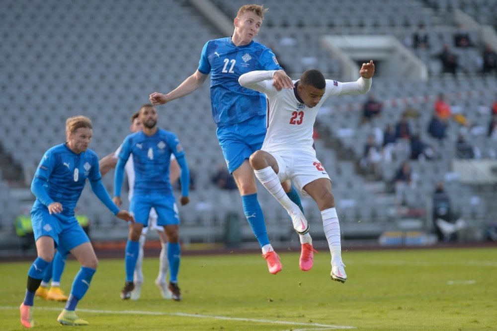Air force: Englands Mason Greenwood and Icelands Jon Bodvarsson challenge for the ball. AFP
