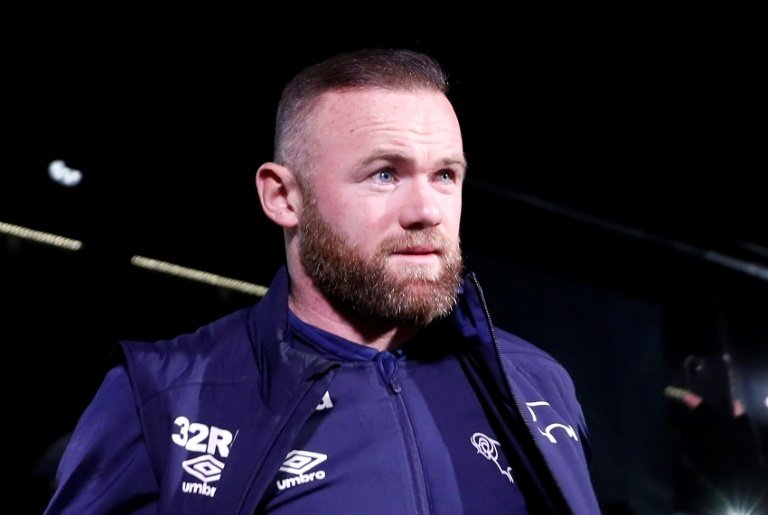 Wayne Rooney has rejected an approach from Everton. AFP