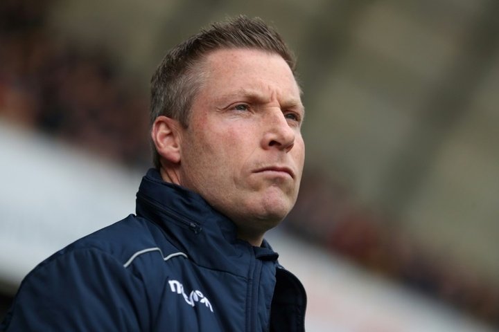 Harris returns as Millwall coach to replace sacked Edwards
