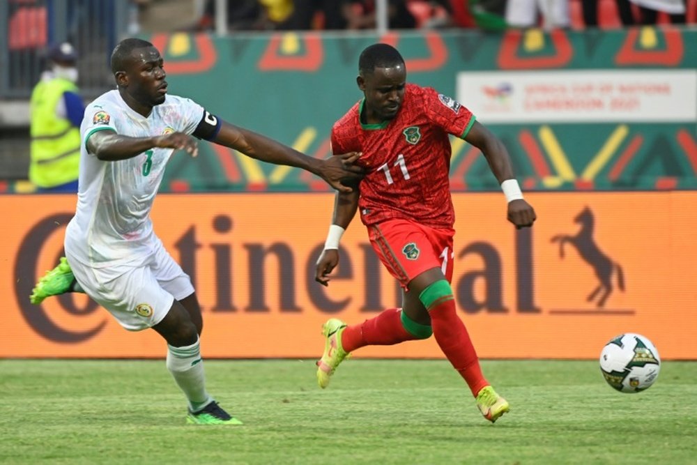 Kalidou Koulibaly chases Malawi forward Gabadinho Mhango during an Africa Cup of Nations match. AFP