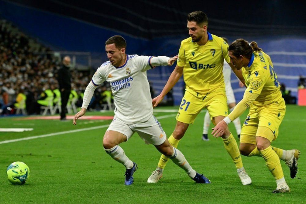 Eden Hazard fights for the ball during Real Madrid's goalless draw with Cadiz on Sunday. AFP