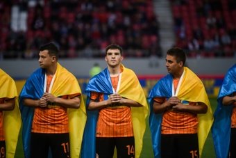Shakhtar Donetsk players walked out draped in Ukrainian flags. AFP