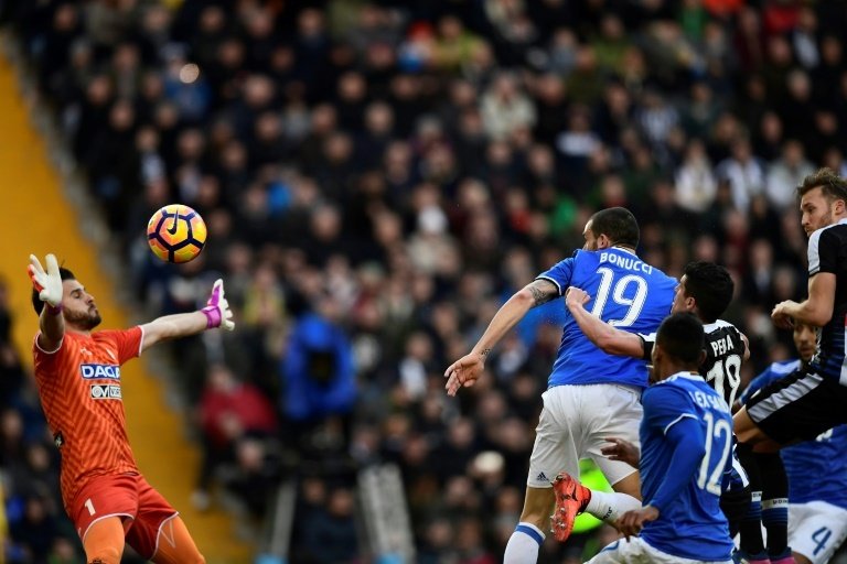 Leonardo Bonucci heads to score during the match Udinese vs Juventus. AFP