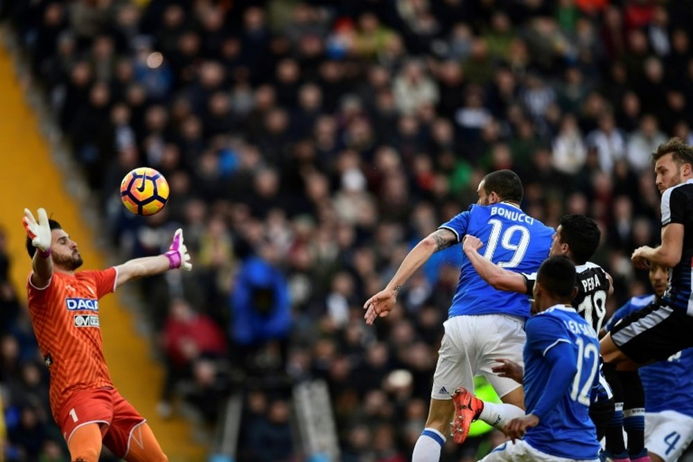Leonardo Bonucci heads to score during the match Udinese vs Juventus. AFP
