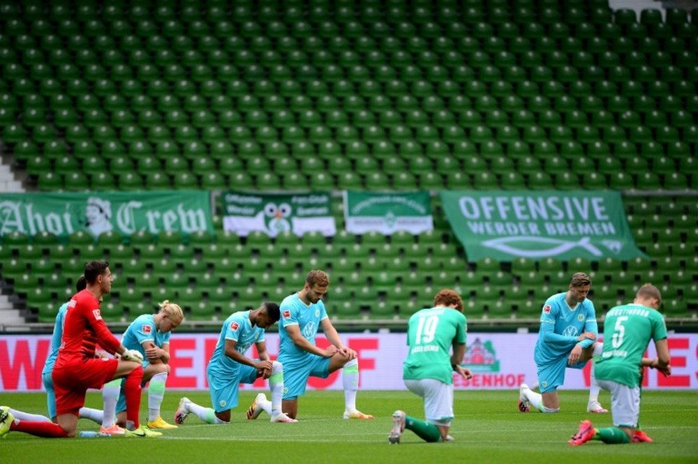 Werder slip towards drop as teams take knee for Floyd protests. AFP