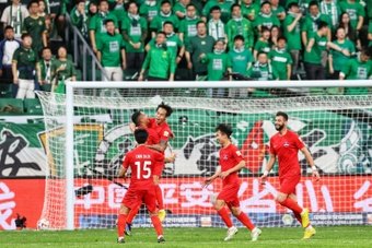 The streets around Beijing's Workers' Stadium were a sea of lime green on Saturday as tens of thousands of football fans turned out for the post-Covid return of the Chinese Super League.