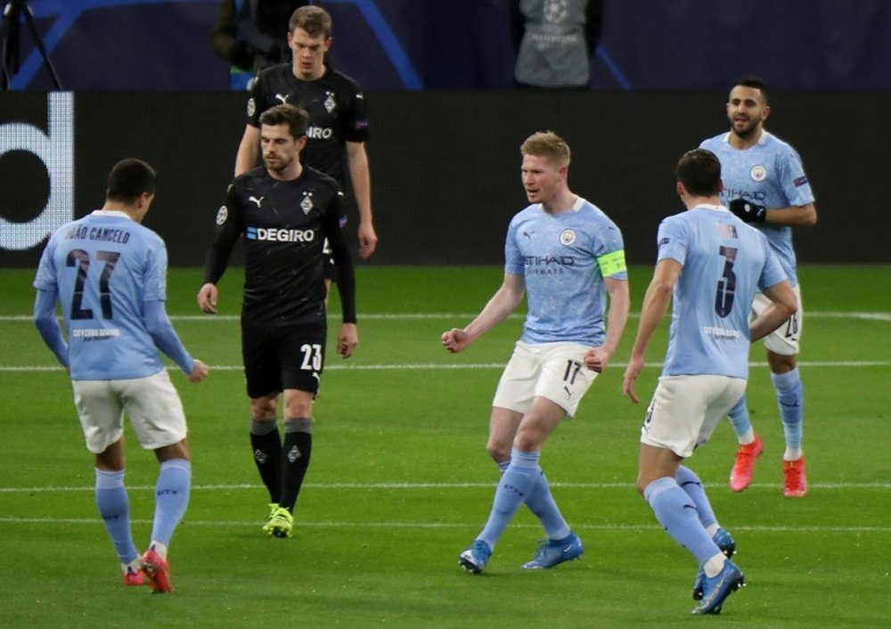 Kevin de Bruyne (C) scored as Man City won 2-0 on the night (4-0 agg). AFP