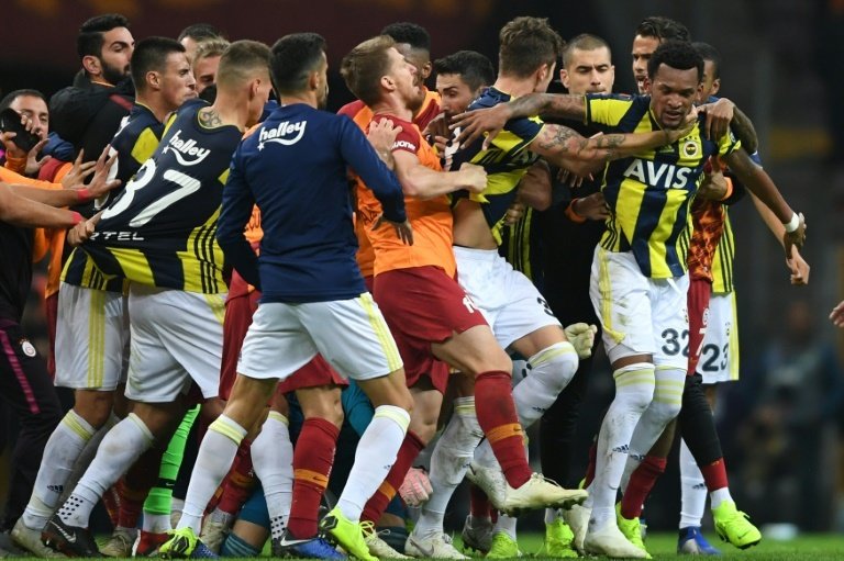 Fenerbahce and Galatasaray players fought at end of derby. AFP