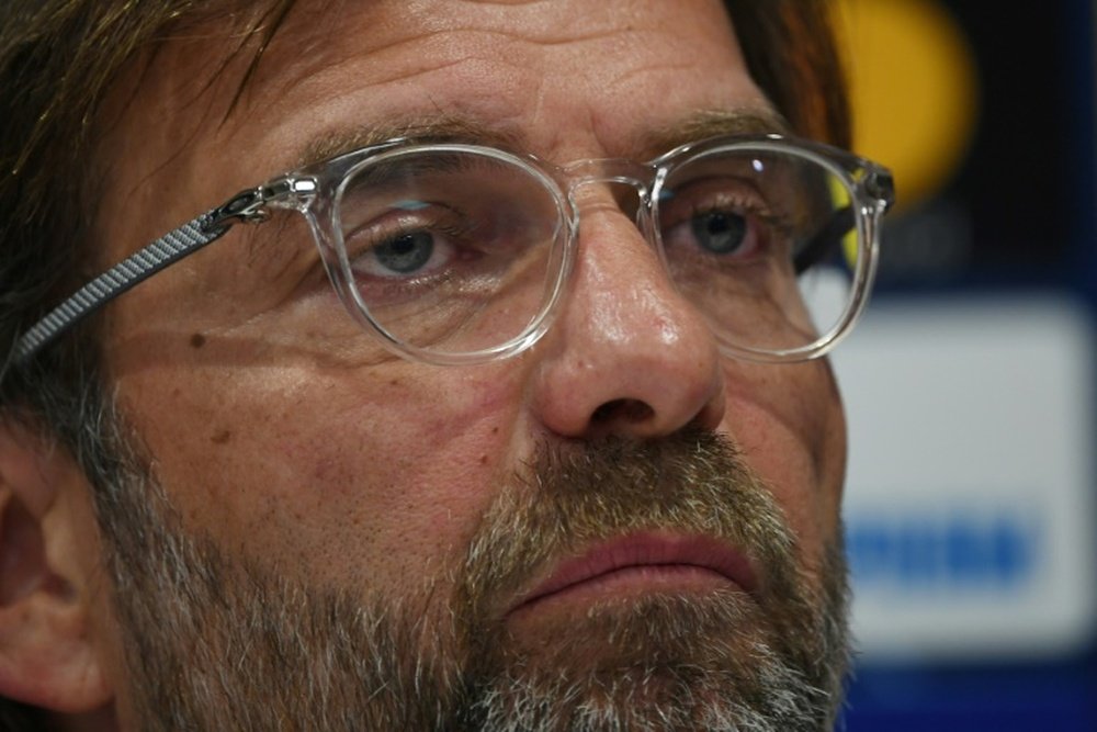 Jurgen Klopp belives his side can win both the Champions League and the Premier League. AFP