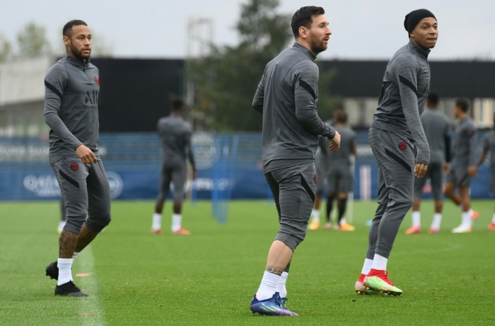 Lionel Messi with Neymar and Kylian Mbappe in training for PSG on Monday. AFP