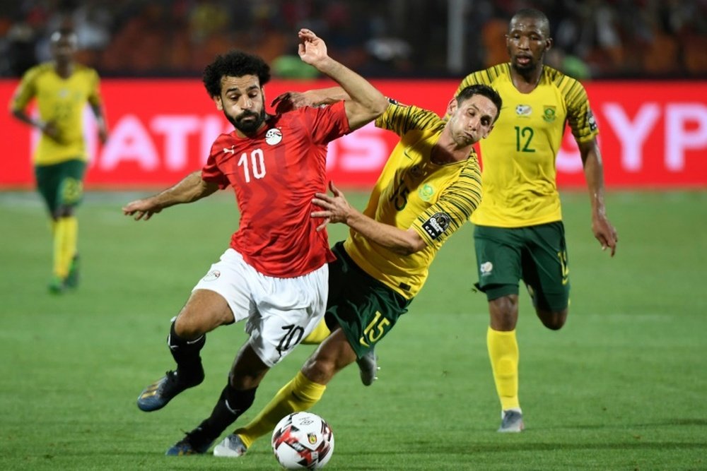 Mohamed Salah (L) playing for hosts Egypt against South Africa. AFP