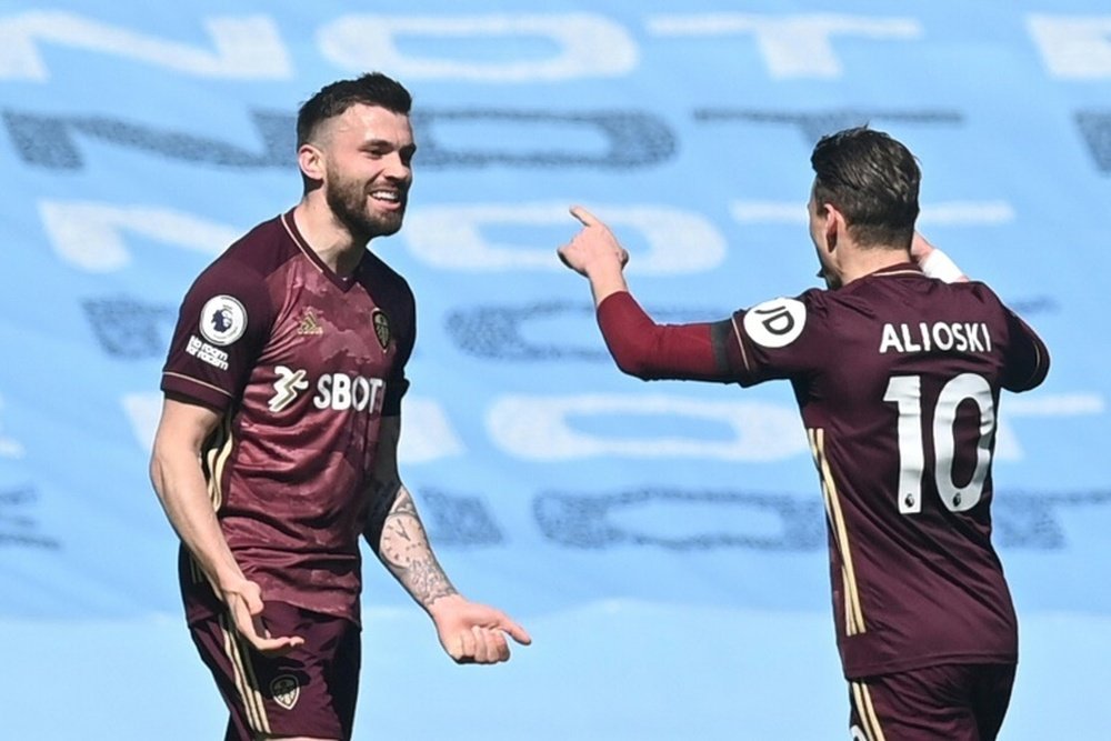 Stuart Dallas (L) gave 10 man Leeds a 2-1 win at Man City in the Premier League. AFP