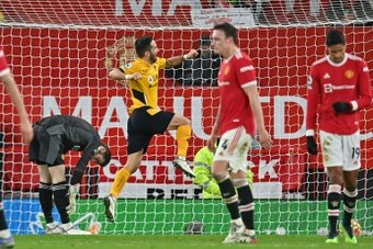Joao Moutinho celebrates after scoring the only goal of Wolves 1-0 win away to Man United. AFP