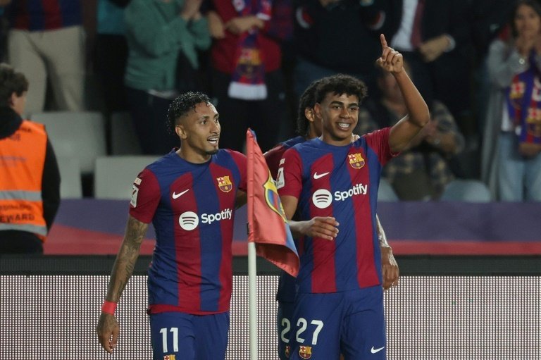 Yamal and Raphinha's goals earned Barca a hard-fought win over La Real. AFP